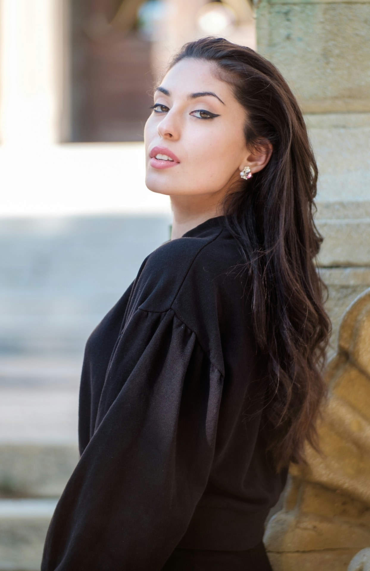 Portrait of a woman with a soft, poised smile and balanced facial proportions