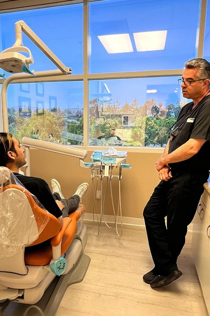 Dr. Reza Tafreshi consulting with a patient