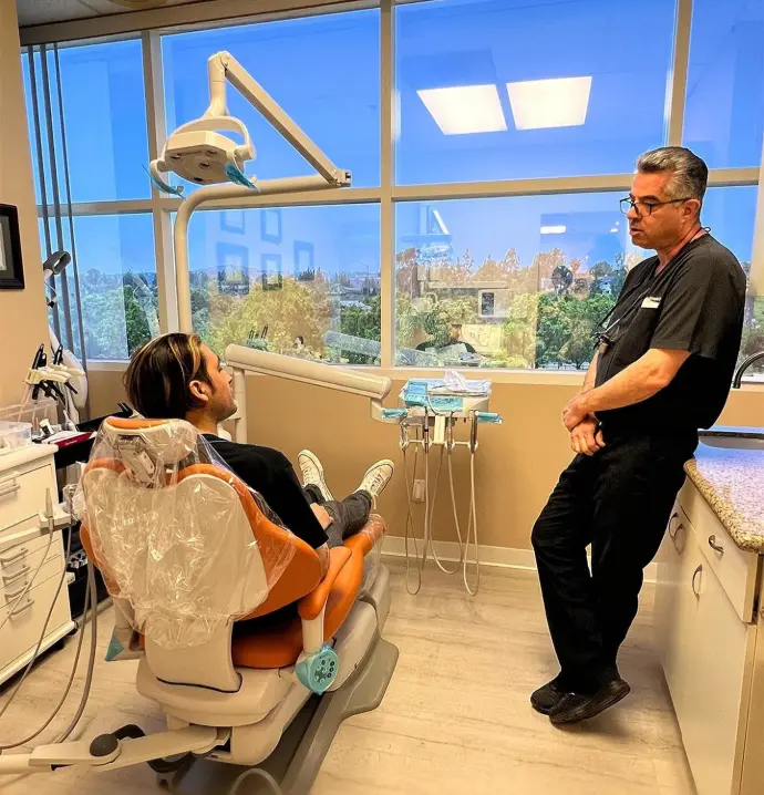 "Dr. Reza Tafreshi consulting a patient"