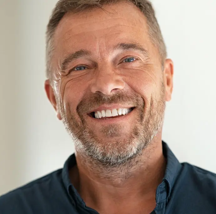 Happy middle aged male implant patient